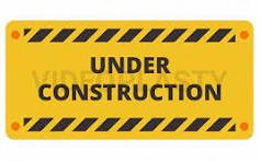 A large group of soldiers in uniforms poses outdoors, with trees and buildings in the background.