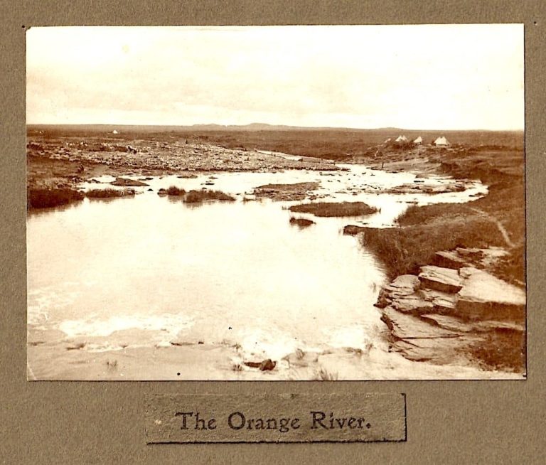 Black and white photograph of the Orange River, showing banks and flowing water.