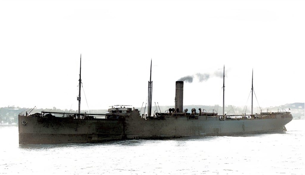 A vintage steamship with multiple smokestacks sailing on calm waters.